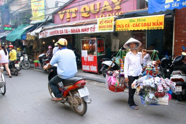 Hanoi woman carrying baskets