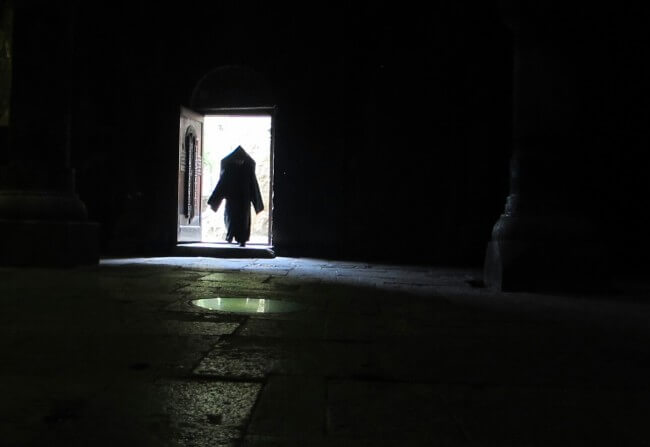 The churches of the Caucuses are like nowhere else in this world. A Monk enters a church in Armenia.